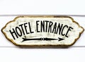 Vintage table with the inscription `Hotel Enterance`