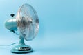 Vintage tabletop fan isolated on a blue background Royalty Free Stock Photo