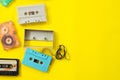 Vintage tape cassette recorder on yellow background