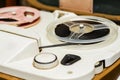 Vintage tape recorder is playing music, close up. Vintage tape recorder roller Royalty Free Stock Photo