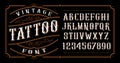 Vintage tattoo font on the dark background Royalty Free Stock Photo