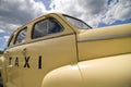 Vintage Taxi Cab in pale yellow Royalty Free Stock Photo