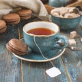 Vintage tea Cup on blue wooden background Royalty Free Stock Photo