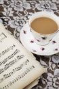 Vintage tea cup,saucer and Musical Sheets Royalty Free Stock Photo