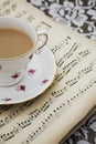 Vintage tea cup,saucer and Old Musical Sheets Royalty Free Stock Photo