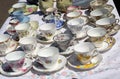 Vintage porcelain tea cups with saucers at flea market