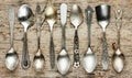 Vintage tea spoons collection on old wooden background Royalty Free Stock Photo