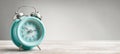 The vintage teal alarm clock showcasing time in a serene setting. AI generated image Royalty Free Stock Photo