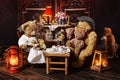 Vintage teddy bear family sitting at the tea table Royalty Free Stock Photo