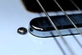 Vintage telecaster neck pickup with chrome cover and guitar strings Royalty Free Stock Photo