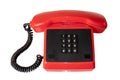 Vintage telecommunication technology. Close-up of a old red telephone with black cable and buttoms. Suitable for contact exchange