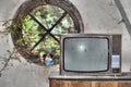 Vintage television in an abandoned building