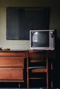 Vintage Television on Retro Desk + Chair - Abandoned Wyoming Hotel - Mullens, West Virginia Royalty Free Stock Photo