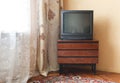 Vintage Television on wooden antique closet, old design in a home Royalty Free Stock Photo