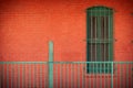 Red Orange Brick Building w Tarnished Green Railing and Window Background 4K UHD 300DPI