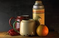 VINTAGE THERMOS FLASK AND ENAMEL KETTLES WITH FRUIT