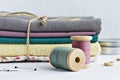 Vintage thread spools, pins, wooden buttons, metal jar and cotton fabrics Royalty Free Stock Photo