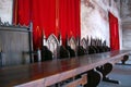 Vintage throne room interior with old wooden seats and long wooden table Royalty Free Stock Photo