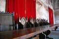 Vintage throne room interior with old wooden seats and long wooden table Royalty Free Stock Photo