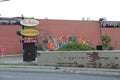 vintage tim hortons always fresh drive thru signs with mural on brick wall