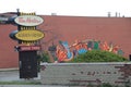 vintage tim hortons always fresh drive thru signs with mural on brick wall