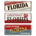 Vintage tin sign collection with US. Florida State. Retro souvenirs or old paper postcard templates on rust background Royalty Free Stock Photo