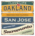Vintage tin sign collection with USA cities. Oakland. San Jose. Sacramento.