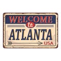 Vintage tin sign with US city. Atlanta. old postcard templates on rust background.