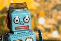 Vintage tin toy robot with computer circuit board background, artificial intelligence concept Royalty Free Stock Photo