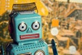 Vintage tin toy robot with computer circuit board background, artificial intelligence concept Royalty Free Stock Photo