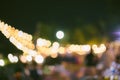 Vintage tone blur image of food stall at night festival with bokeh for background usage. Festival Event Party with People Blurred Royalty Free Stock Photo