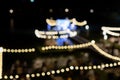 Vintage tone blur image of food stall at night festival with bokeh for background usage. Festival Event Party with People Blurred Royalty Free Stock Photo