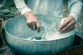 Filtered image Asian hand rolling cotton candy with bamboo stick in floss machine in Vietnam