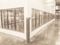 Vintage tone row of empty commercial fridges at wholesale big-box store Royalty Free Stock Photo