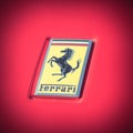 Vintage tone Ferrari logo on the luxury red supercar close up
