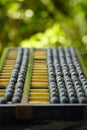 Old abacus and hold electronic calculator. picture financial concept design. Royalty Free Stock Photo