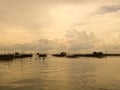 Vintage tone of homestay and floating basket in lake at Kohyo, Songkhla, Thailand with beautiful sky and clouds. This is tradition Royalty Free Stock Photo
