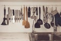 Vintage tone of Kitchen cooking utensils on rack Royalty Free Stock Photo