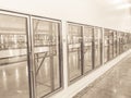 Vintage tone row of empty commercial fridges at wholesale big-box store