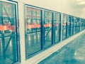 Vintage tone row of empty commercial fridges at wholesale big-box store Royalty Free Stock Photo