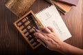 Vintage tone of women`s hands doing accounting with old accounts . financial concept Royalty Free Stock Photo