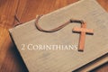 Vintage tone of wooden Christian cross necklace on holy Bible wi Royalty Free Stock Photo