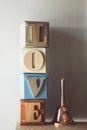 Vintage tone of word LOVE spelled out on a row of lettered Royalty Free Stock Photo