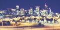 Vintage toned blurred Denver city lights at night. Royalty Free Stock Photo