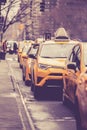 Vintage Toned Image Of Line Of NYC Yellow Taxicabs On Street In Manhattan