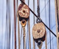 Vintage toned old sailing ship wooden pulleys. Royalty Free Stock Photo