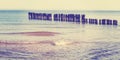 Vintage toned panoramic beach view with tilt shift effect. Royalty Free Stock Photo