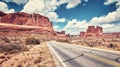 Vintage toned panoramic picture of a scenic road, USA.