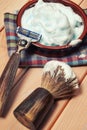 Vintage toned shaving eqip, razor blade, brush, gel on the wooden table Royalty Free Stock Photo