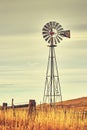 Vintage toned windmill tower, American wild west symbol.